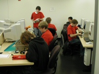 students prepare robot in the pit room