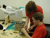 students work on robot body