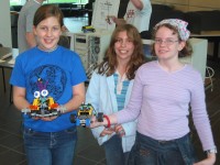 Students holding robots